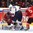 HELSINKI, FINLAND - DECEMBER 26: Canada's Mason Mcdonald #1 makes a glove save with pressure from USA's Matthew Tkachuk #7 during preliminary round action at the 2016 IIHF World Junior Championship. (Photo by Matt Zambonin/HHOF-IIHF Images)

